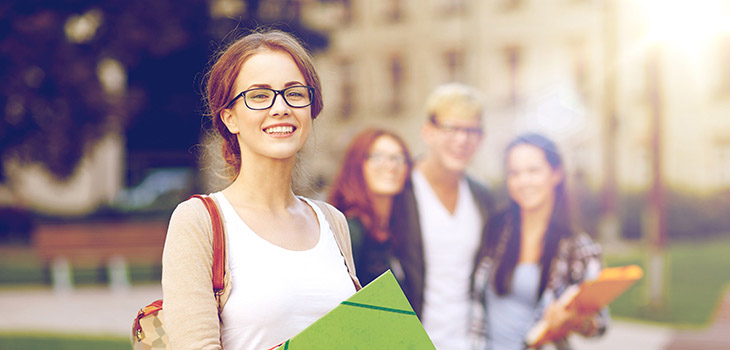 Student smiles into the camera.